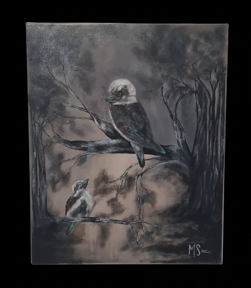 A square canvas painting of two kookaburras perched on branches in a dark, moody forest scene, displayed on a light gray wall.